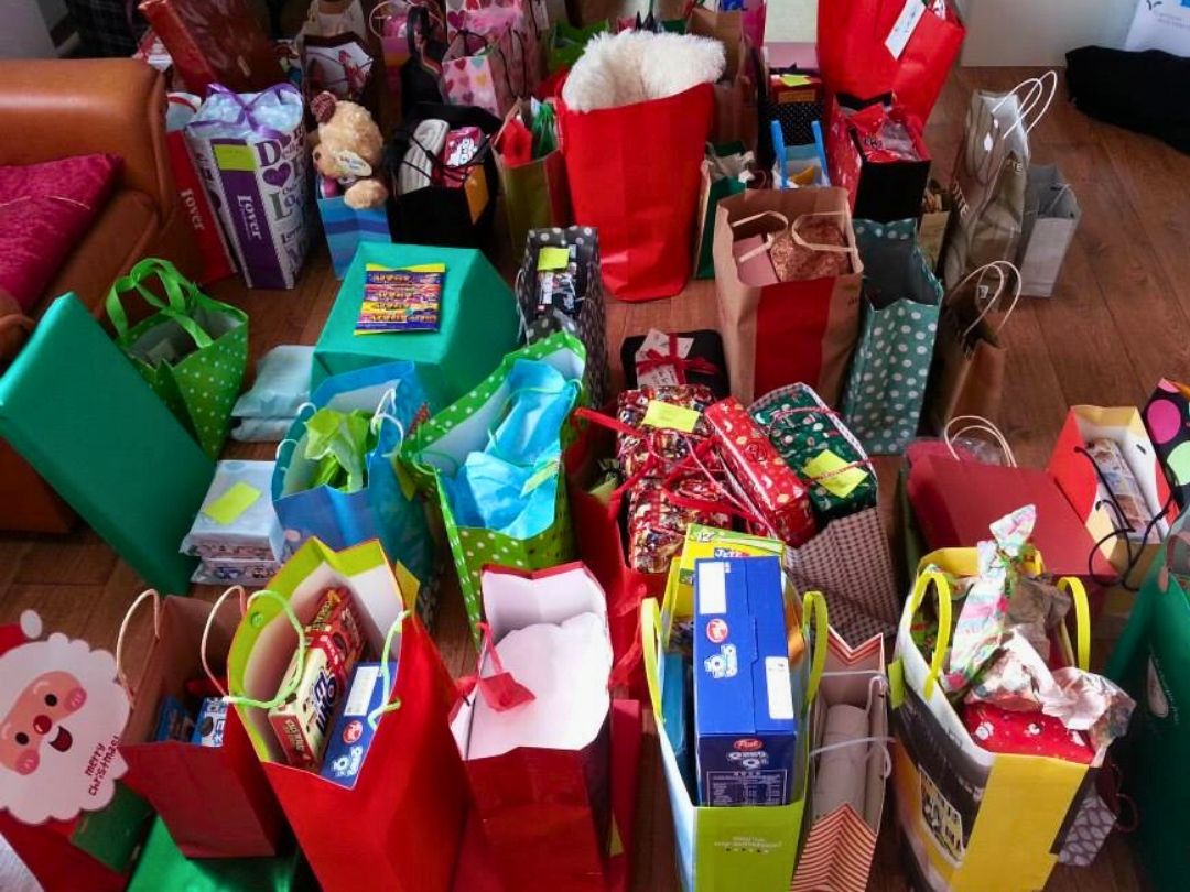 Holiday gift bags and presents prepared for children’s homes in Korea as part of KKOOM’s history.